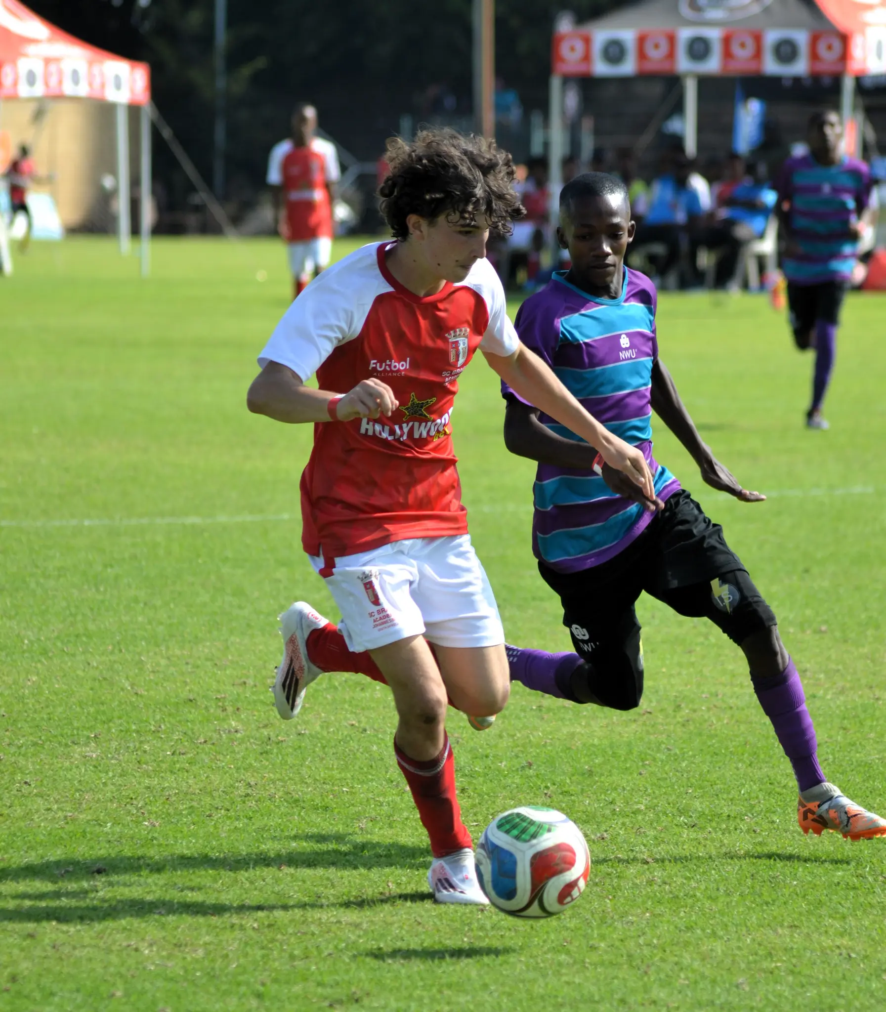 Cameron Harrison carrying the ball forward in a Touch Perfect match